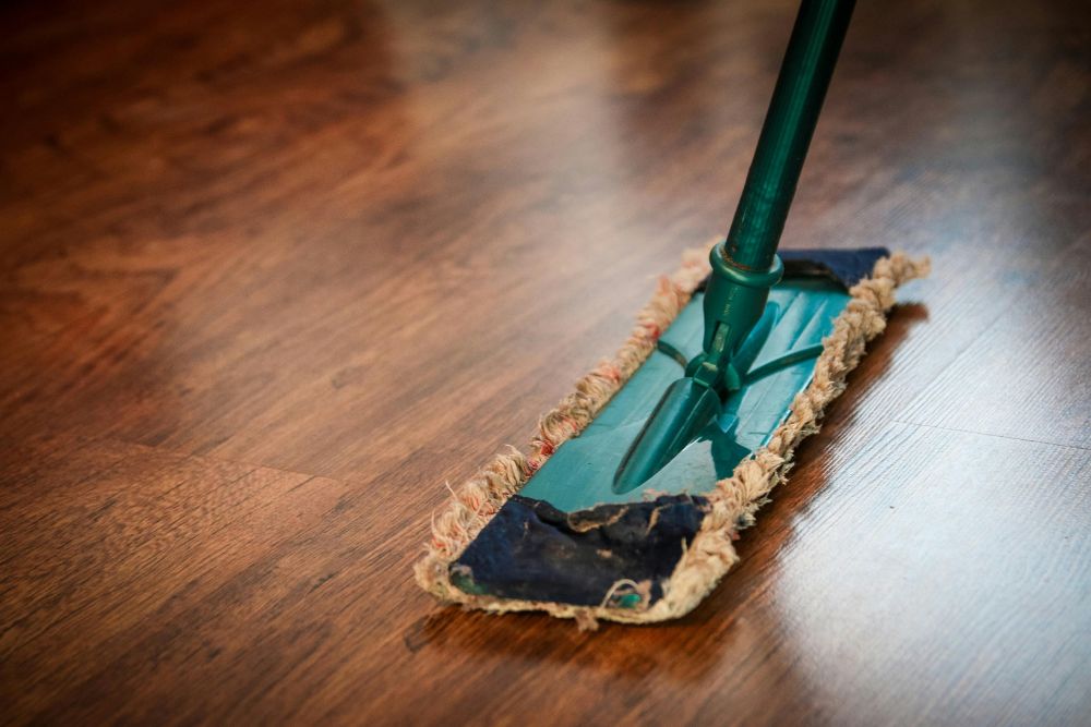Deep cleaning process for High Point hardwood wax removal and floor maintenance.