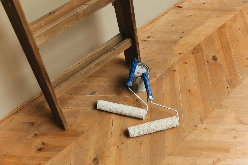 Professional tools for High Point hardwood wax removal on chevron patterned floors.