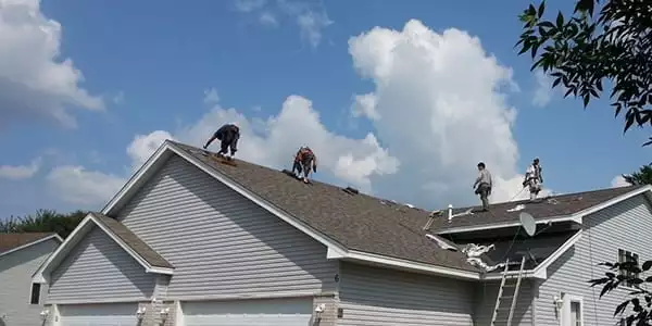 North Palm Beach Residential Roofing Companies team from FL Pro Roofing & Solar installing shingles on a residential home.
