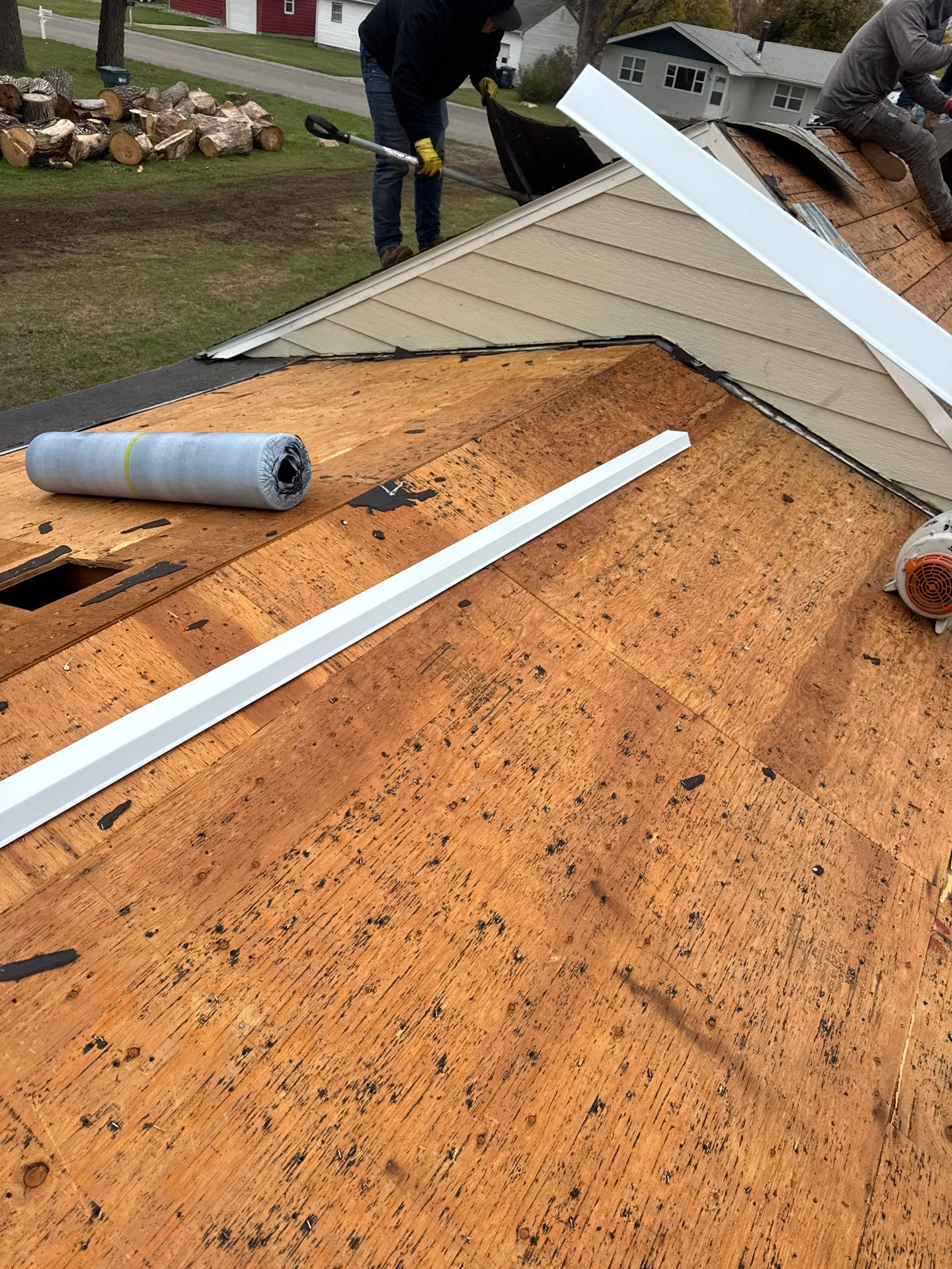 Roofing Installation Hickory NC by Burish Builders CLT. Close-up of bare wood roof deck during installation, showing drip edge.