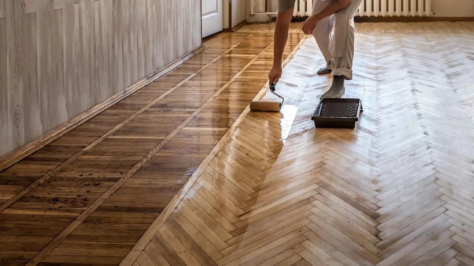 Hardwood Clean Buff Mint Hill NC by Good House Floor Care: Professional applying a fresh finish to parquet wood flooring.