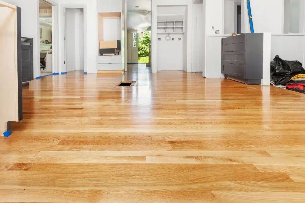 Completed hardwood floor refinishing Mercer Island featuring a high-gloss finish on oak wood.