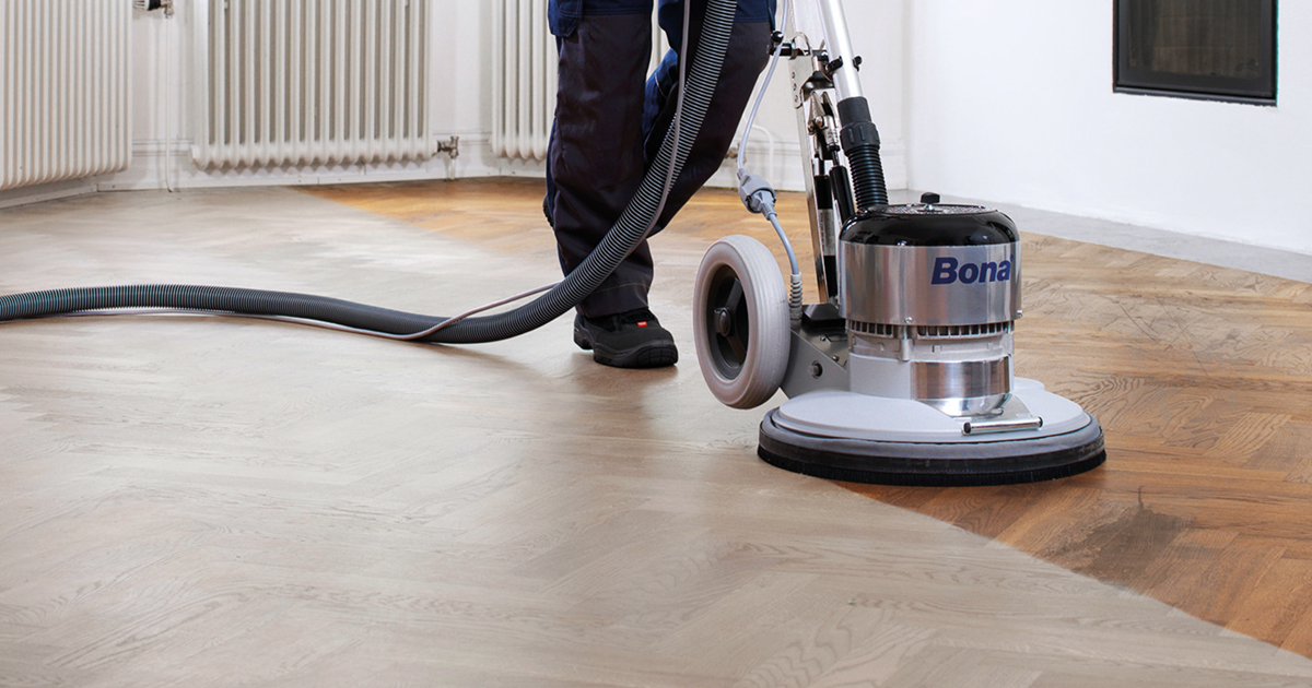 Hardwood Floor Refinishing Mint Hill NC by Good House Floor Care using a professional Bona sander on herringbone floors.