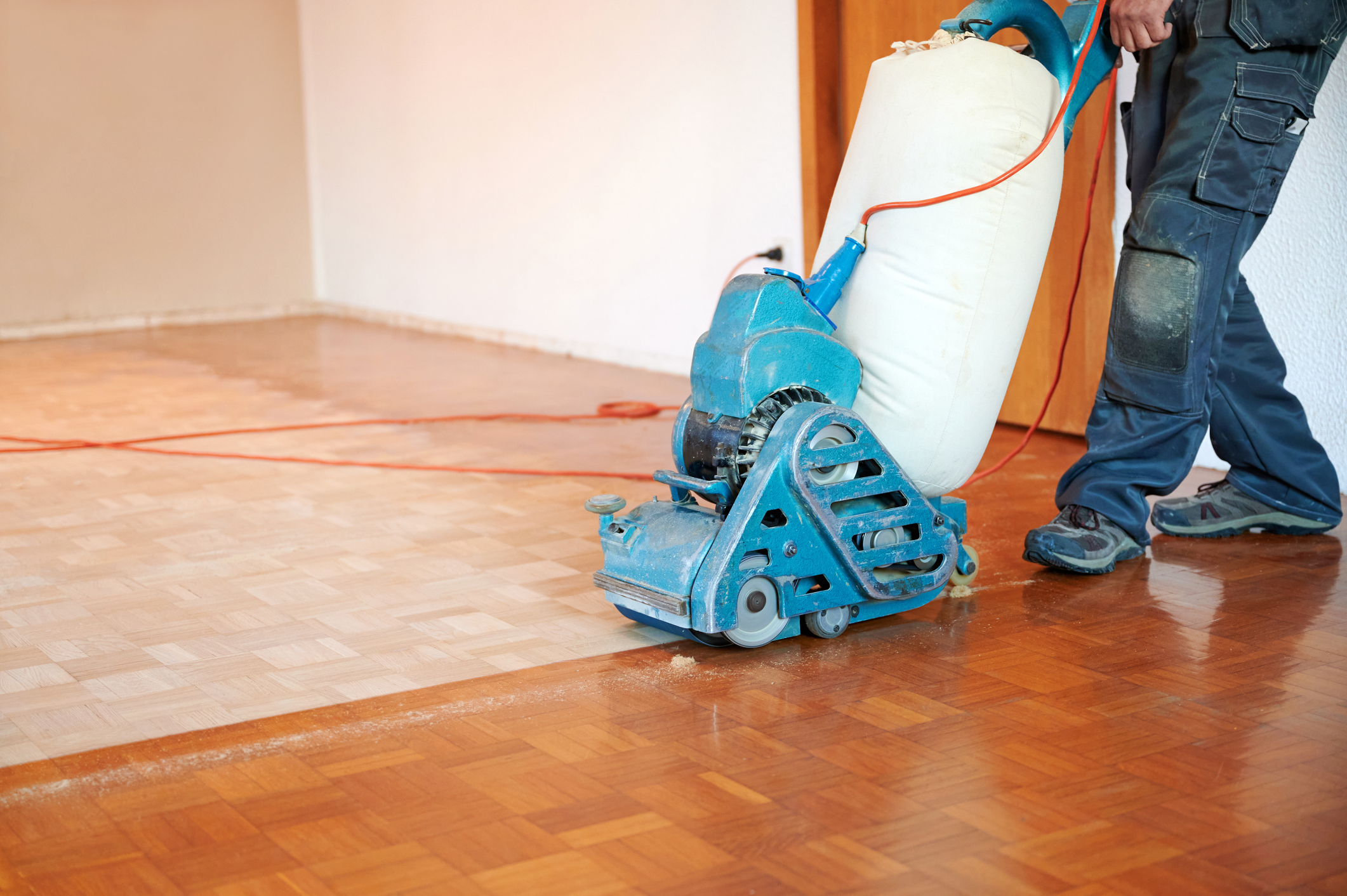 Hardwood Floor Refinishing Pineville NC by Good House Floor Care: Professional sanding of a parquet wood floor.