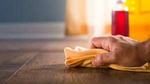 Hardwood Floor Wax Removal Salisbury NC by Good House Floor Care: Close-up of a hand buffing wood floors to a clean, deep shine.