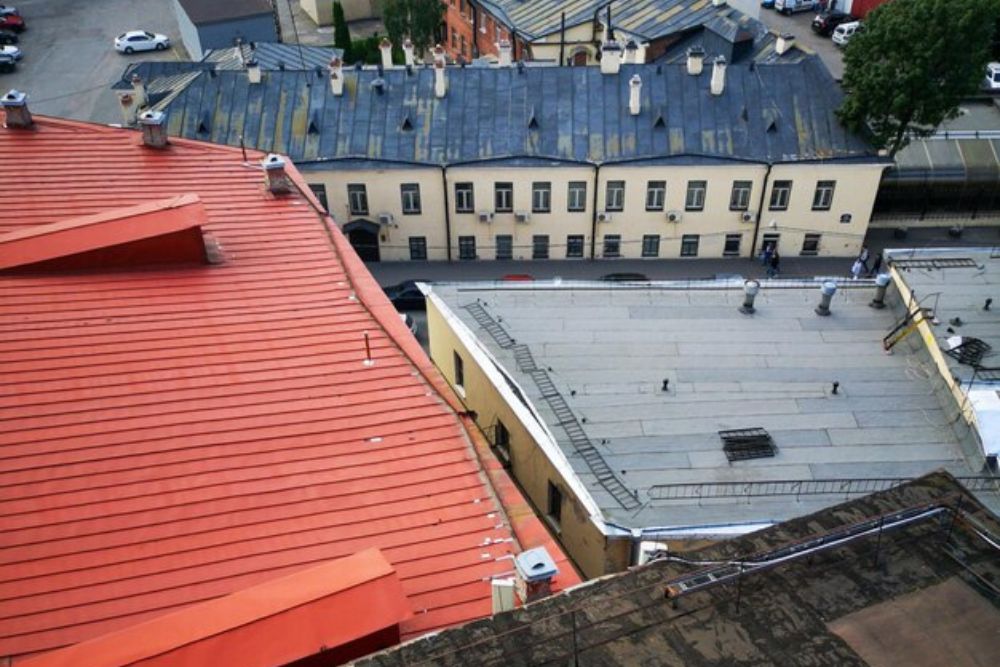 Close-up of a terracotta-style metal tile system installed by an Oakland residential roof repair specialist.