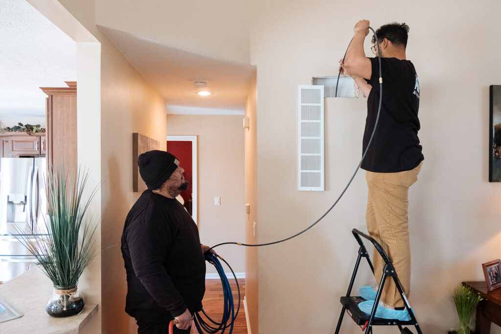 Residential Airduct Cleaning Colorado Springs, CO by HP Air Duct Cleaning technicians using professional agitation tools.