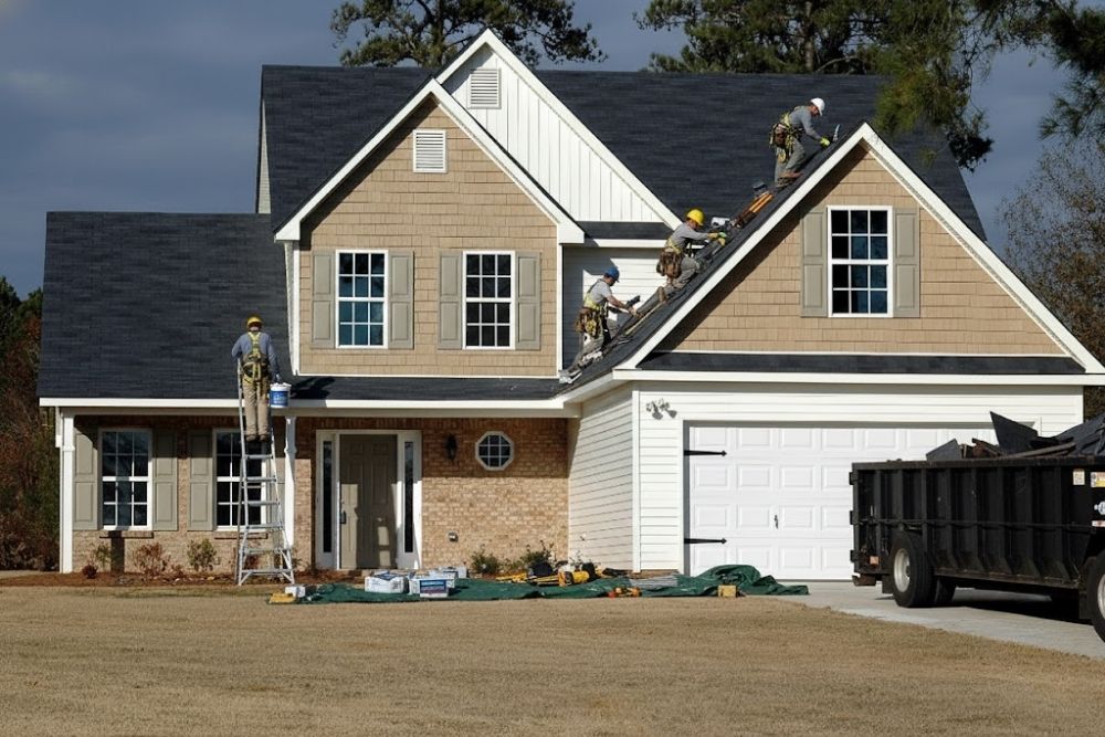 Professional contractors performing residential roof repair Scott MN on a two-story home.
