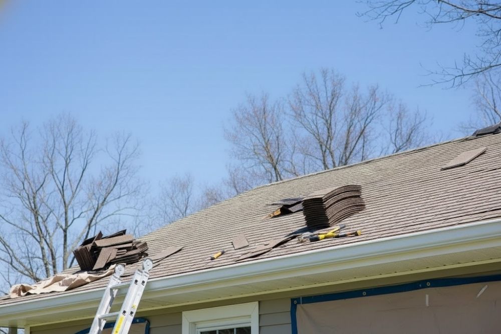 New asphalt shingles and tools laid out by residential roofing contractors Scott MN for a home roof replacement.