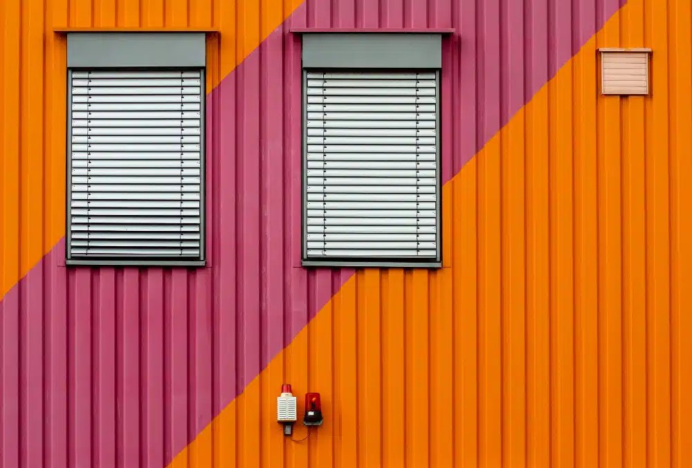 Modern orange and purple vertical metal siding installed by a residential siding contractor Washington MN.