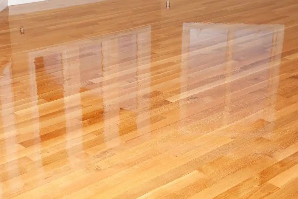 High-gloss hardwood floor finish after a professional screen and recoat Mercer Island.