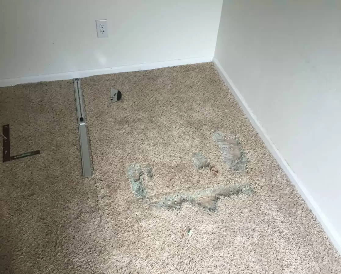 Professional carpet repair Colorado Springs CO by Premier Carpet Cleaning using precision tools to fix holes and transitions.