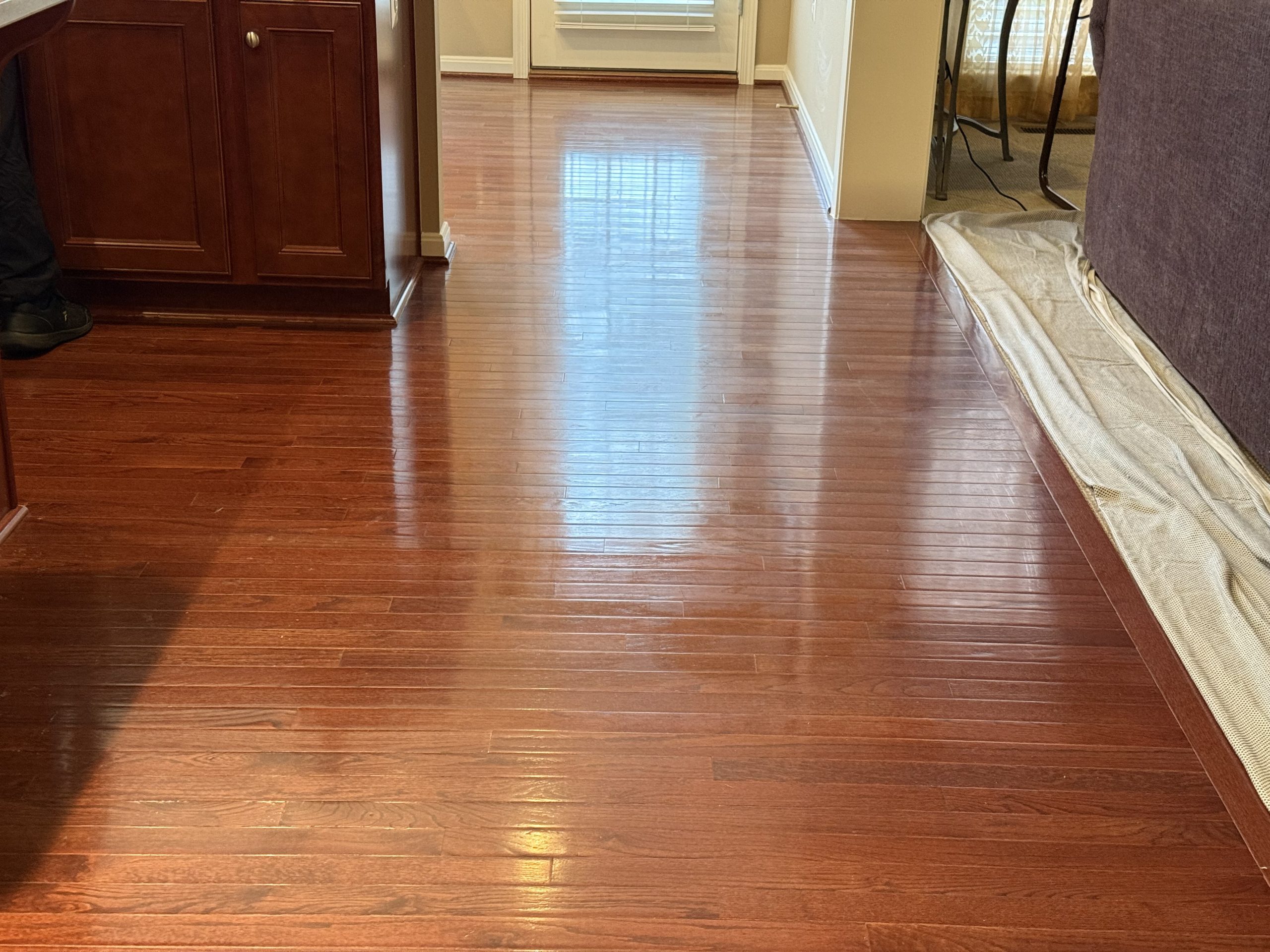 Hardwood Floor Wax Removal Montclair VA by Spotless Carpet Cleaning & Hardwood Floor Care showing shiny, refinished wood.