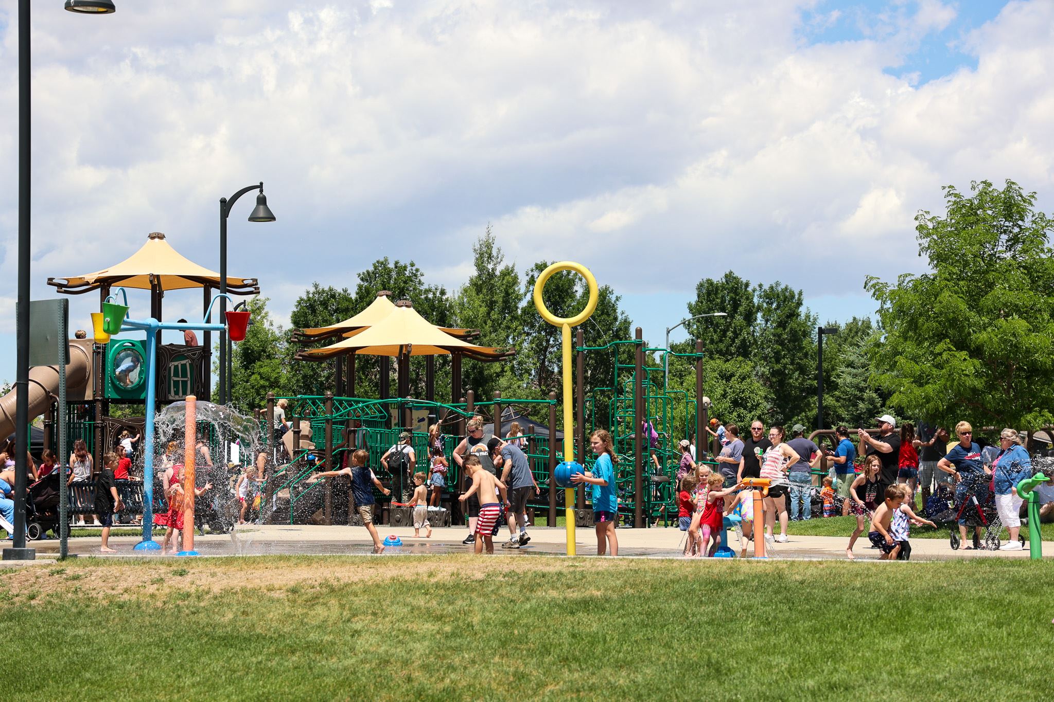 Google Business Profile optimization North Wellington by Top Click Joe Inc: Families enjoy the colorful park splash pad.
