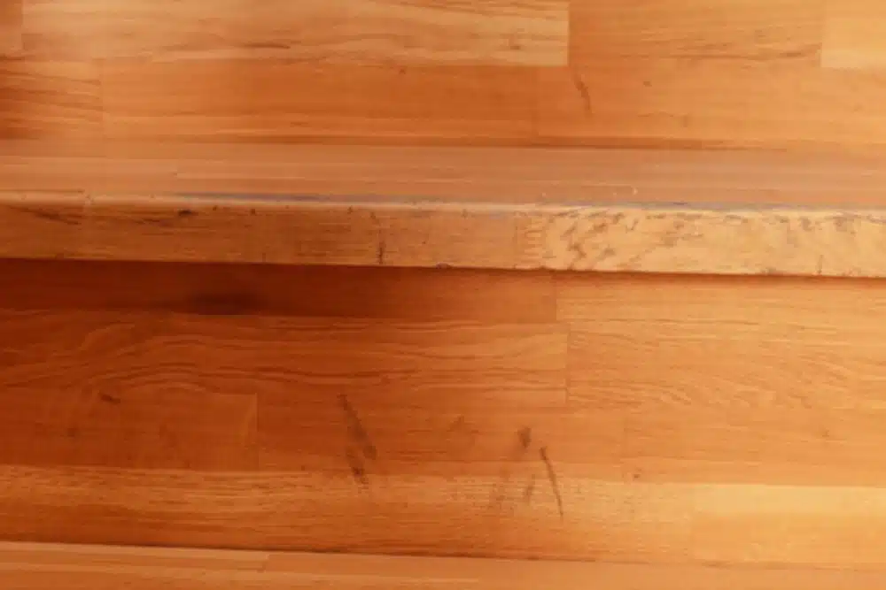 Close-up of wood stairs needing a professional clean and buff Bellevue WA.