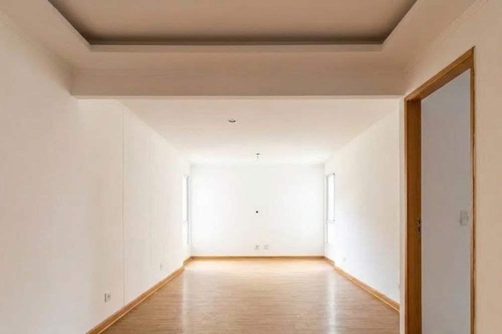 Professional hardwood floor refinishing Kirkland WA in a bright, modern empty room with white walls.