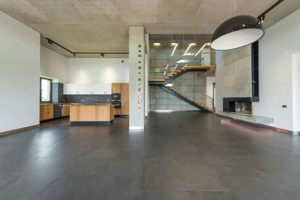 Large-format flooring in an open-concept kitchen and living area by Chamblee, GA Hardwood Floor Refinishing.