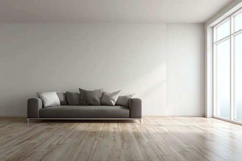 Clean and Buff Sammamish WA hardwood floor in modern living room with gray sofa and natural light