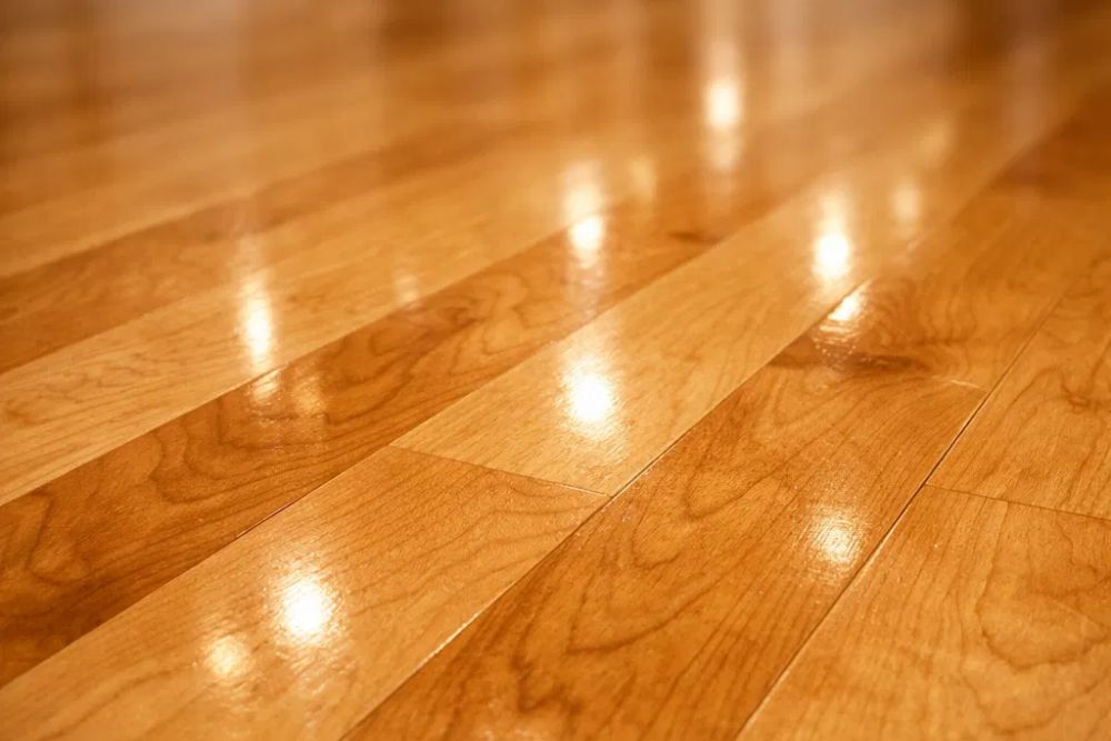 Close-up of a freshly clean and buffed hardwood floor in Tacoma WA, showing a glossy finish.