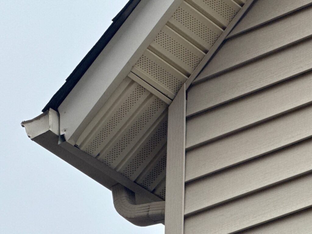 Close-up of a home exterior by Wegner Roofing & Solar showing the need for professional gutter installation Franklin TN.