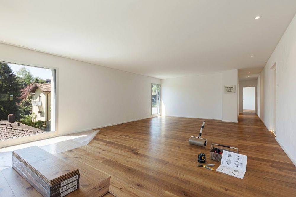 Professional LVT deep clean and protect service in an empty Mercer Island apartment, restoring wood-look plank floors.