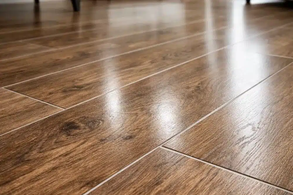 Close-up of a perfectly protected and clean LVT floor in Seattle WA, reflecting light and showcasing a durable, pristine finish after deep cleaning and protection.