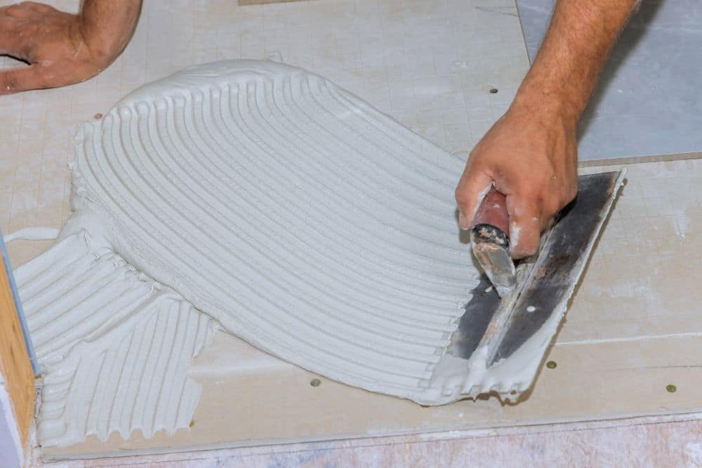 North Atlanta GA Commercial Flooring Installation troweling adhesive