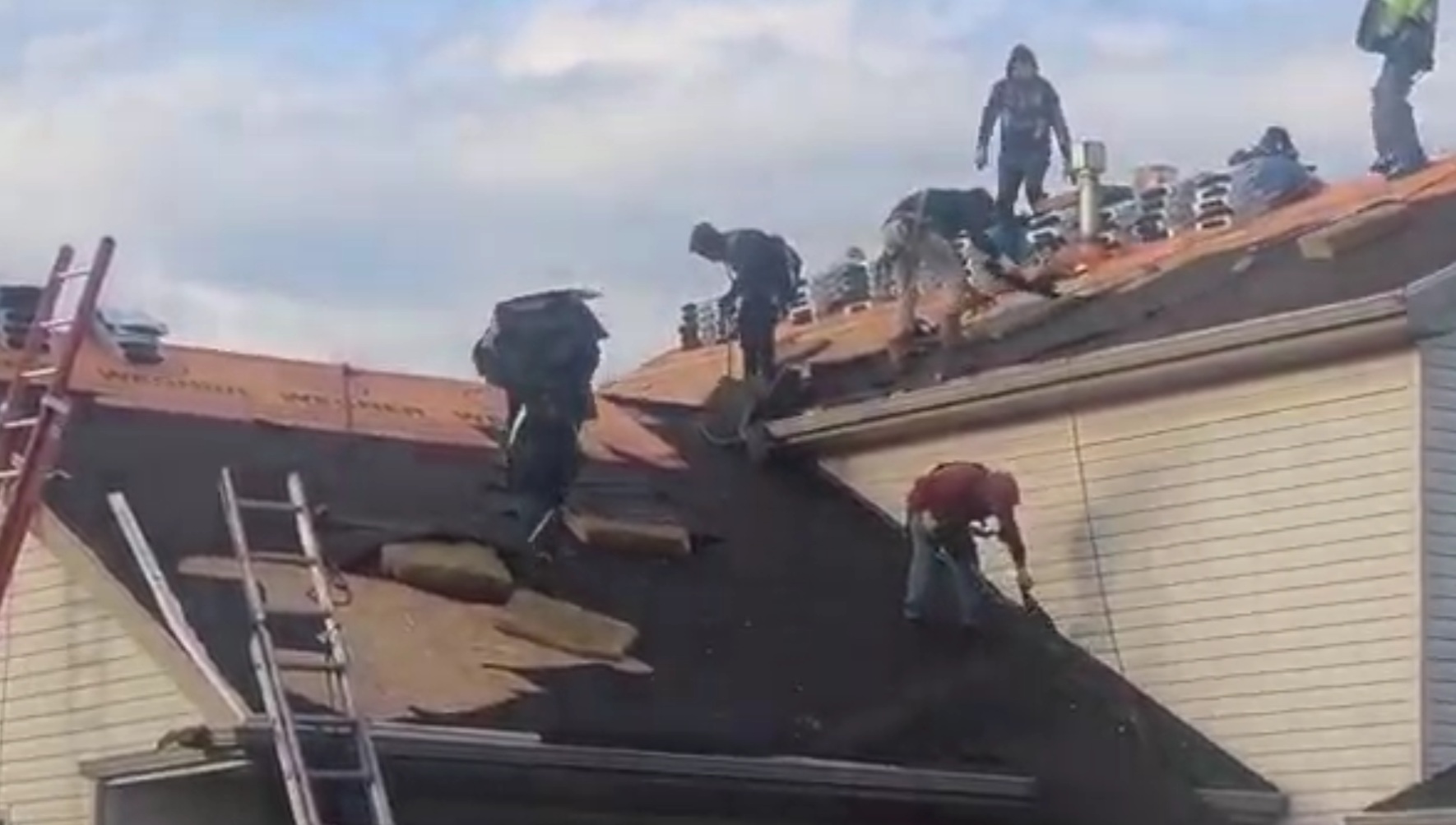 Professional roofers Nashville TN team from Wegner Roofing & Solar performing a full roof replacement on a residential home.