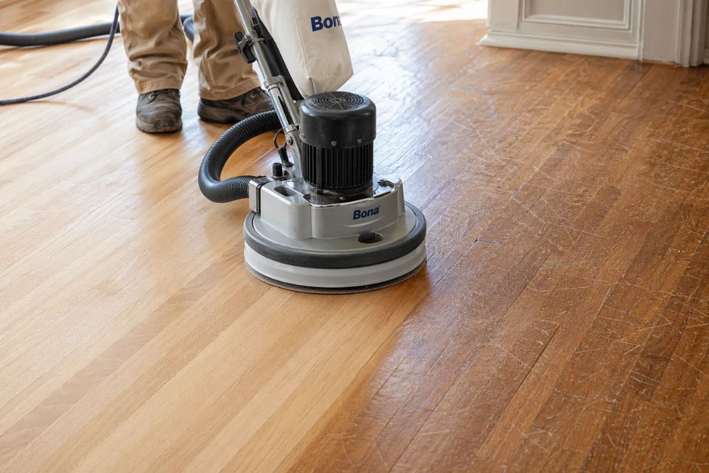 Professional hardwood floor screening in progress, preparing for recoat by a Hardwood Floor Polishing & Maintenance Lynnwood WA specialist.