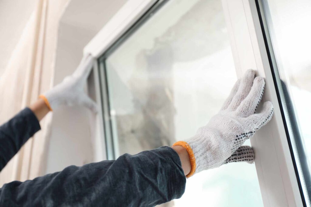 Expert installers performing a professional Window Replacement Des Moines Iowa for a local home by Wegner Roofing & Solar.