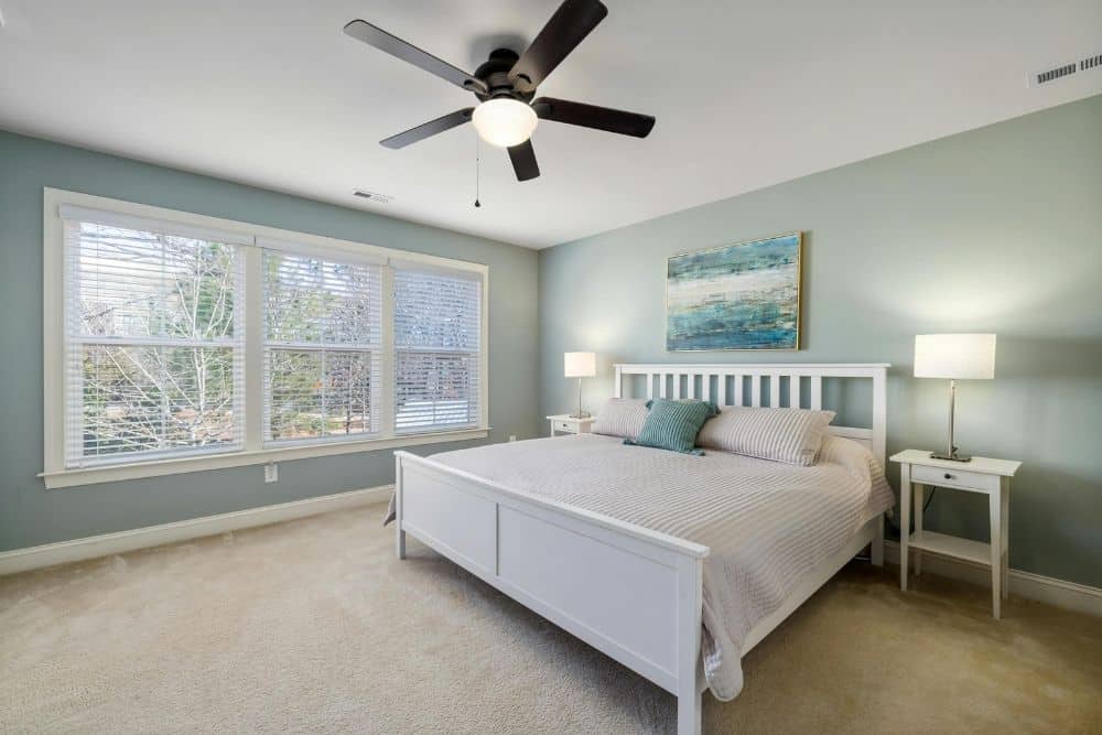 Completed Chamblee, GA carpet installation featuring plush, neutral carpeting in a bright, coastal-style bedroom.