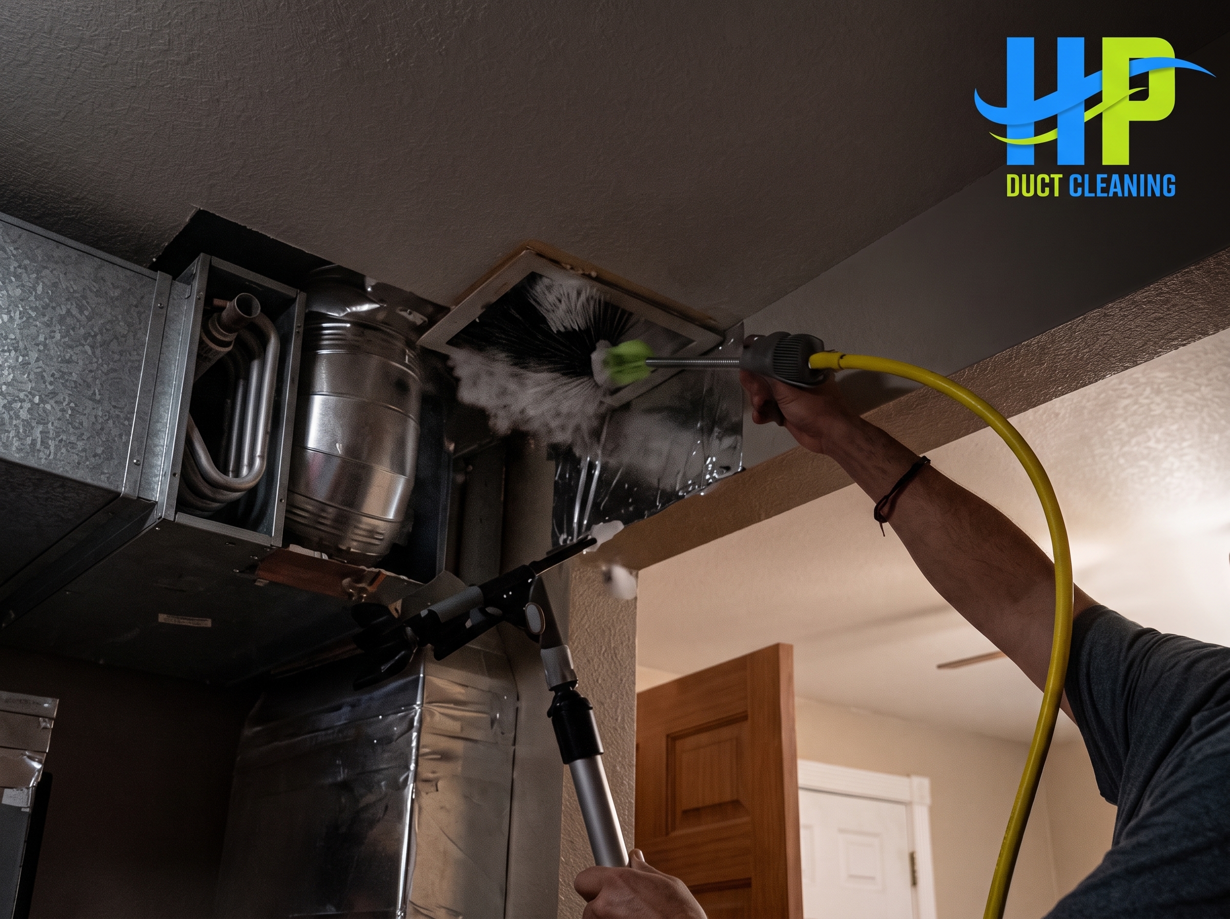 HP Duct Cleaning tech performing Residential Air Duct Cleaning Black Forest CO using a brush tool to remove dust from vents.